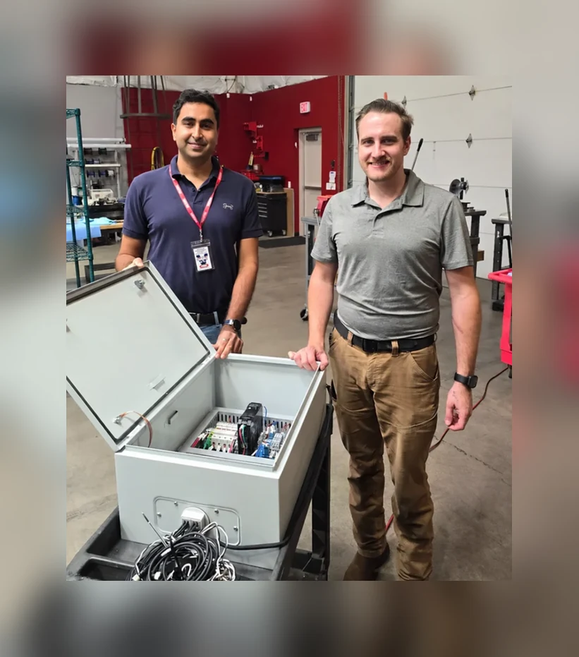 Team with HVAC monitoring and controls panel